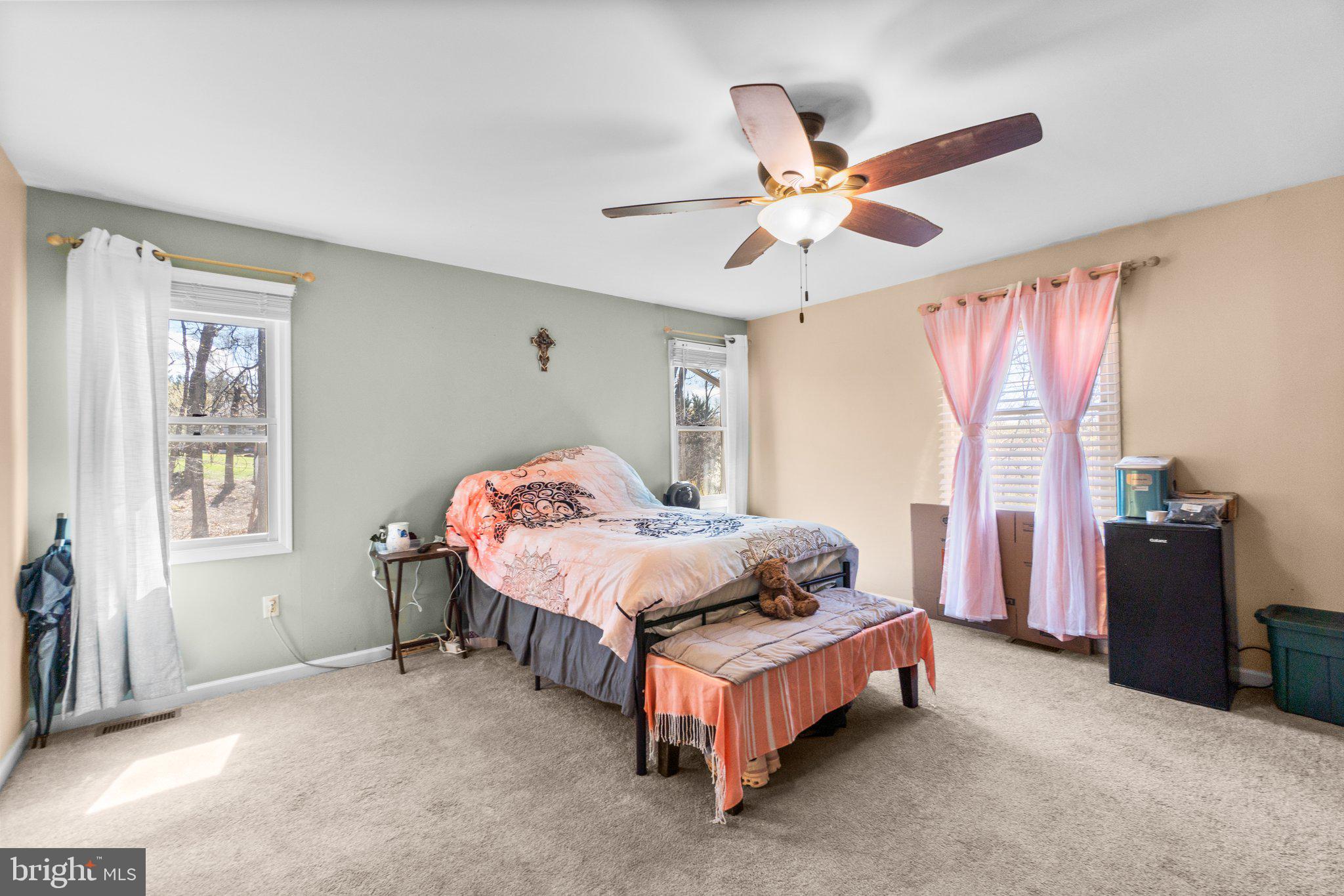 4701 Gross Mill Road Hampstead, MD 21074 - Photo 15 of 62 a bedroom with a bed and a chandelier