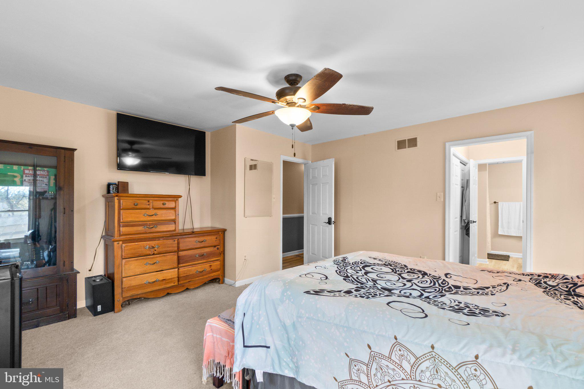 4701 Gross Mill Road Hampstead, MD 21074 - Photo 16 of 62 a bedroom with a bed and a television