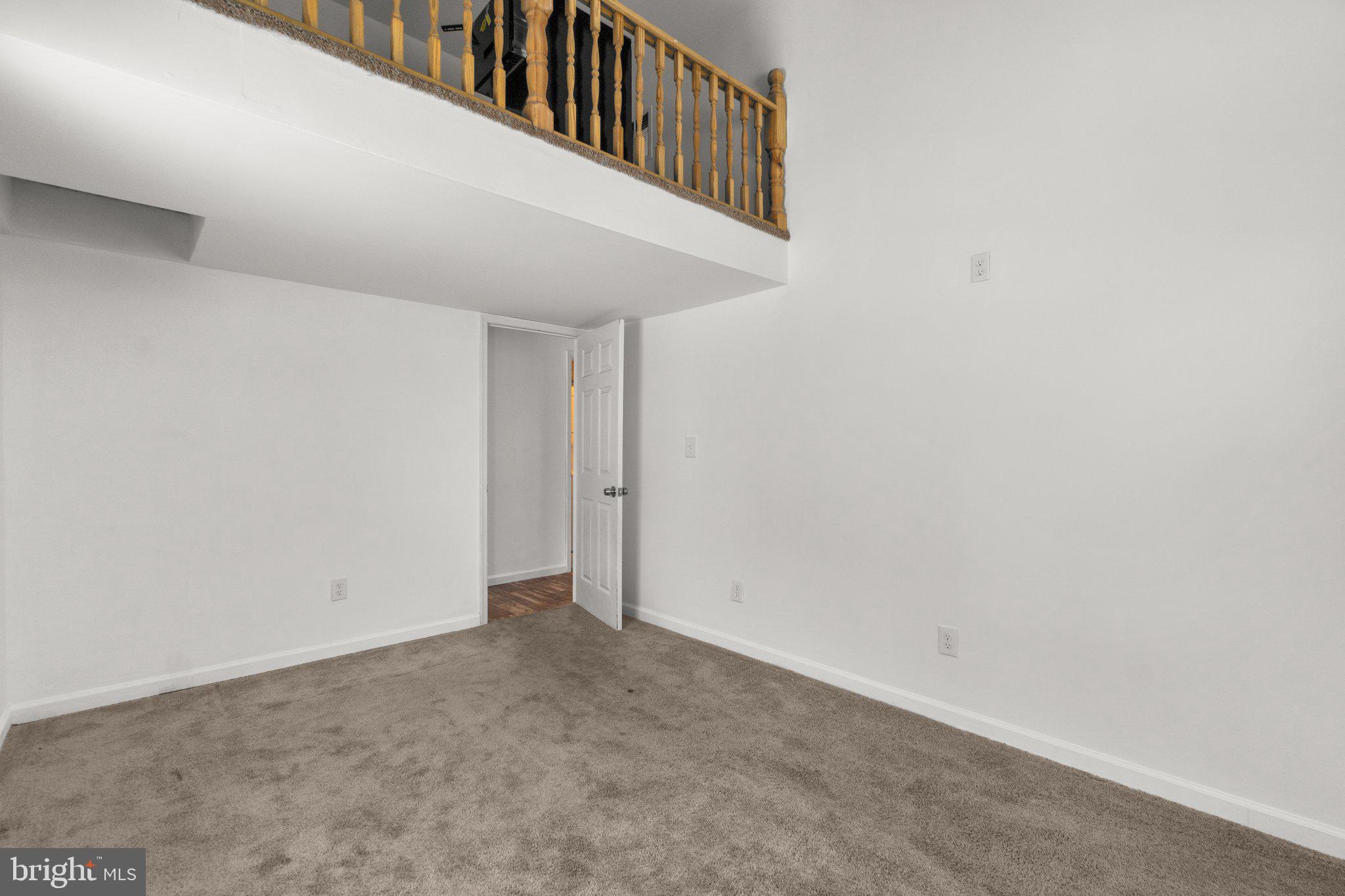 4701 Gross Mill Road Hampstead, MD 21074 - Photo 22 of 62 a view of an empty room with wooden floor