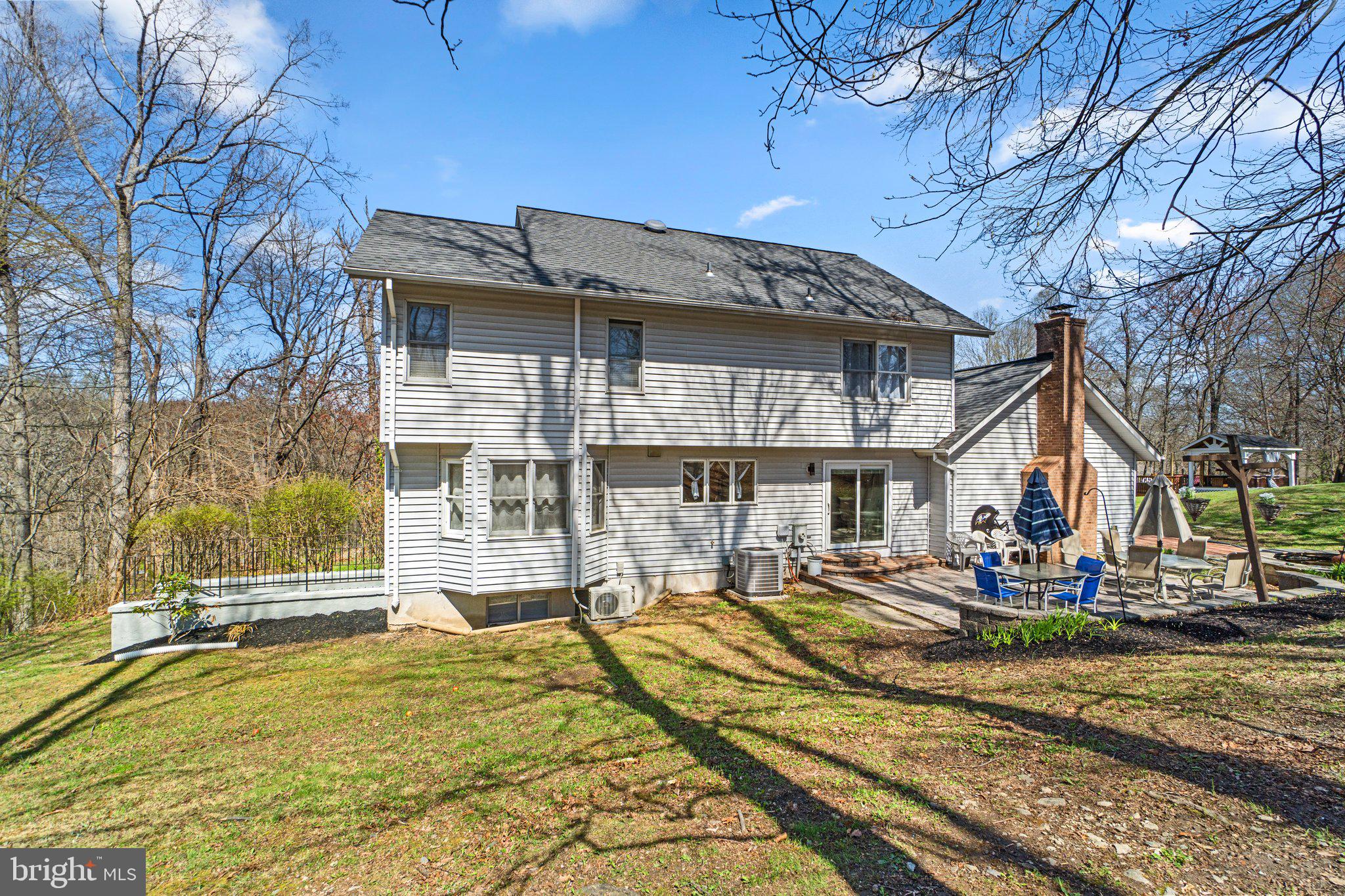4701 Gross Mill Road Hampstead, MD 21074 - Photo 38 of 62 a front view of a house with a yard