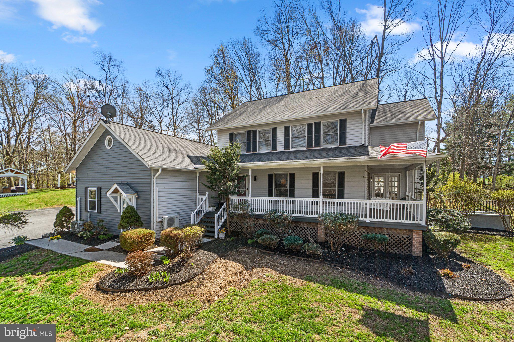 4701 Gross Mill Road Hampstead, MD 21074 - Photo 53 of 62 a front view of a house with a yard outdoor seating and mountain view
