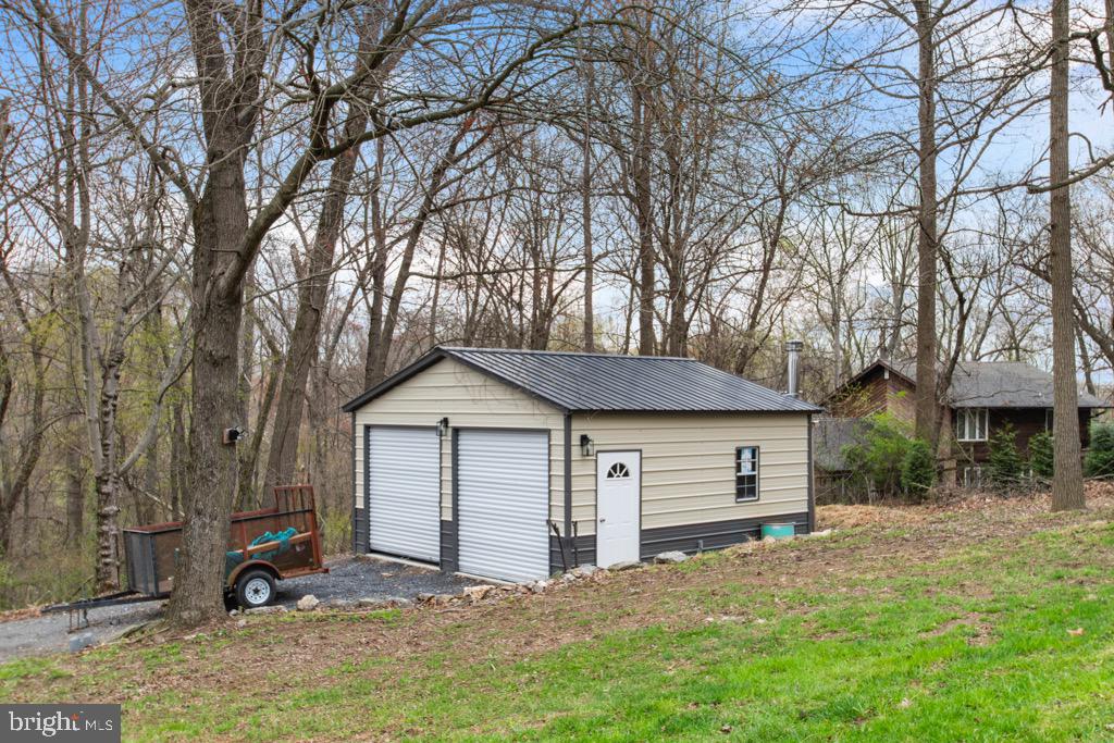 4701 Gross Mill Road Hampstead, MD 21074 - Photo 54 of 62 a front view of a house with a yard