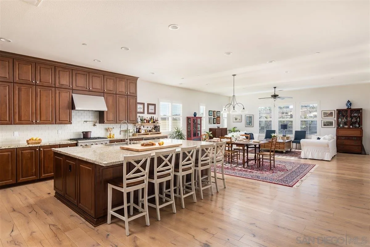 1309 Malone Court Escondido, CA 92026 - Photo 4 of 39 a kitchen with lots of wooden furniture appliances and cabinets