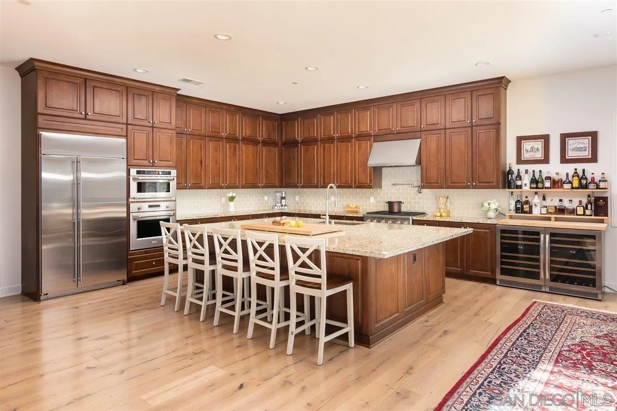 1309 Malone Court Escondido, CA 92026 - Photo 5 of 39 a kitchen with a stove a sink and a refrigerator