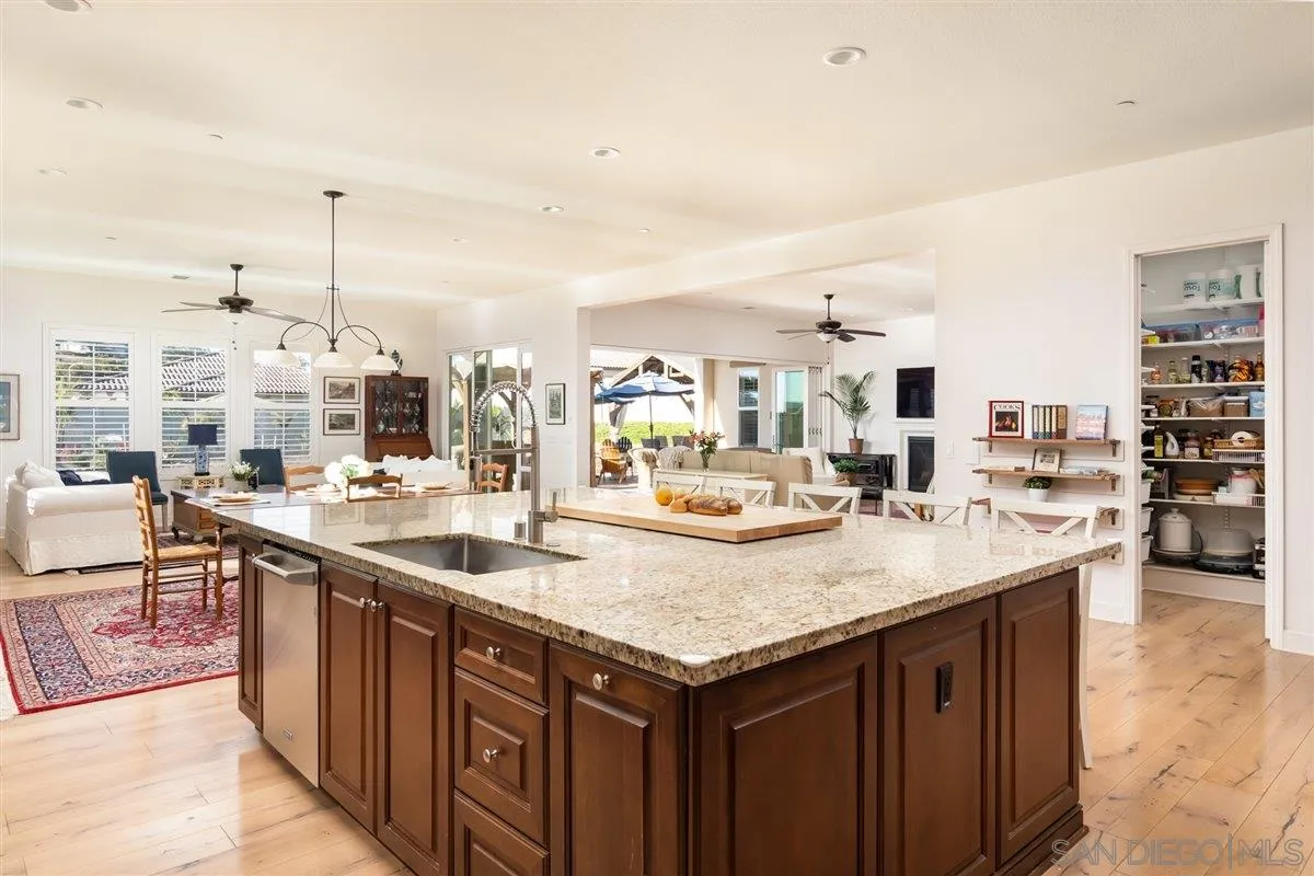 1309 Malone Court Escondido, CA 92026 - Photo 9 of 39 a kitchen with a sink and cabinets