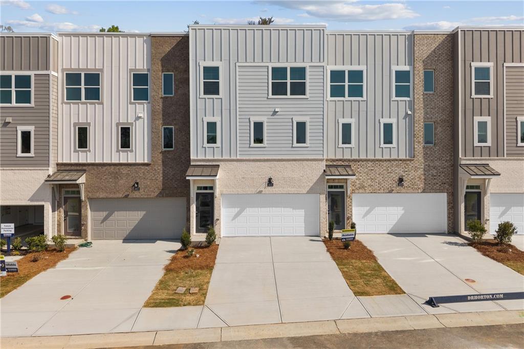 a view of a white building with many windows