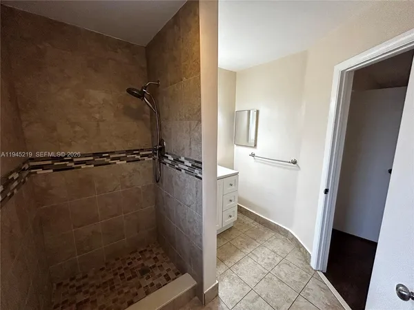 a bathroom with a sink and a shower