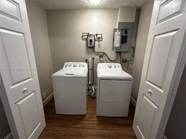 a utility room with dryer and washer
