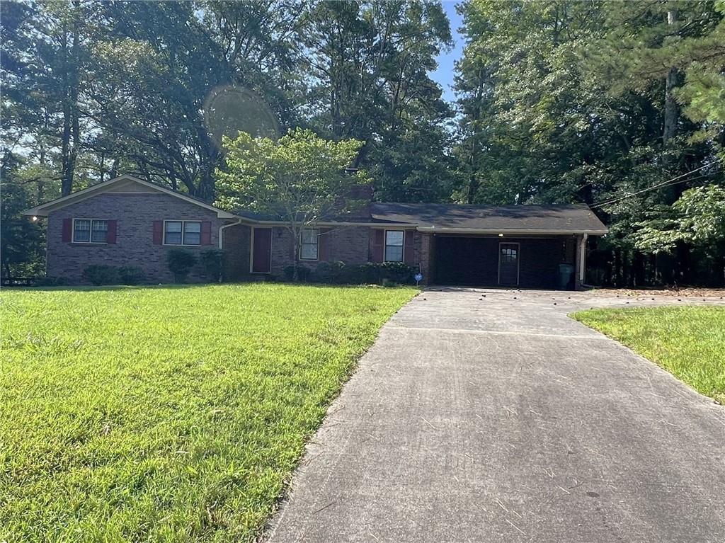 3000 Gravel Springs Road Buford, GA 30519 - Photo 2 of 6 a front view of a house with a yard