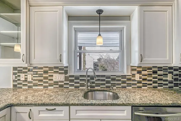 a kitchen with sink and window