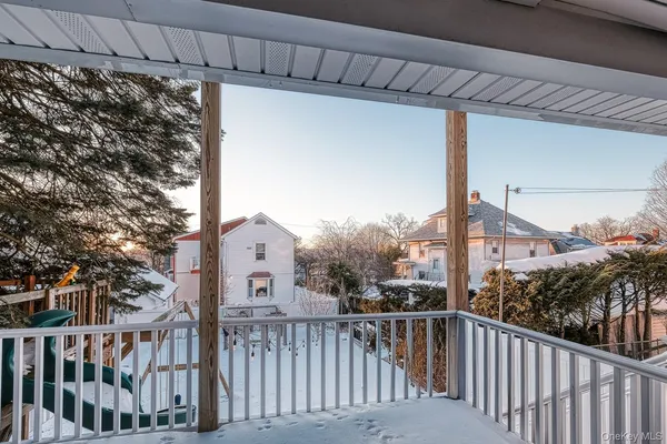 a view of a balcony with a tree