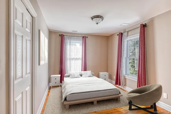 a bathroom with a toilet a sink a vanity and mirror