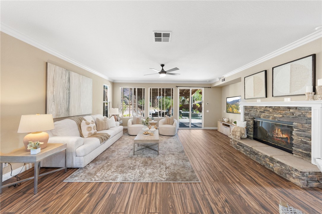 31465 Inverness Court Temecula, CA 92591 - Photo 24 of 75 Expansive family room features a beautiful fireplace that creates a warm and inviting focal point | Professionally Staged