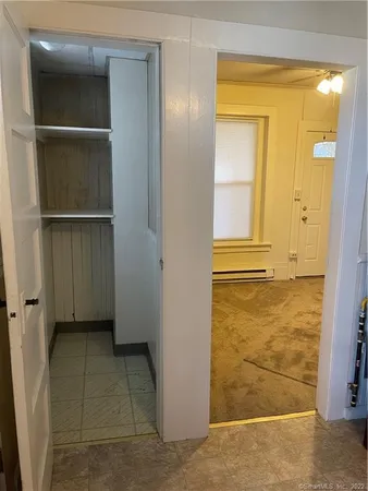 a view of an empty room with a bathroom