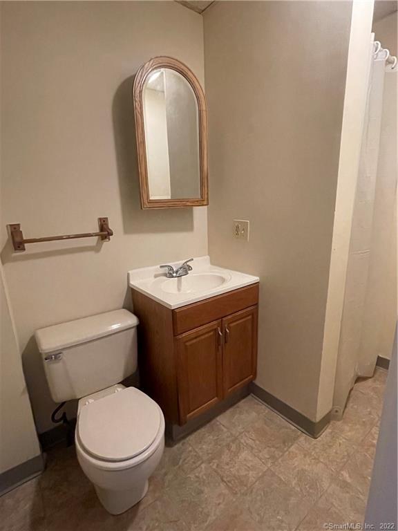 227 Howe Avenue Shelton, CT 06484 - Photo 6 of 8 a bathroom with a toilet sink and mirror