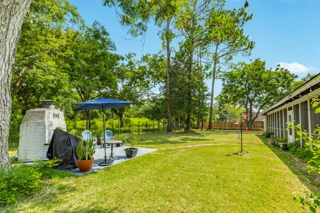 a view of a backyard with swimming pool
