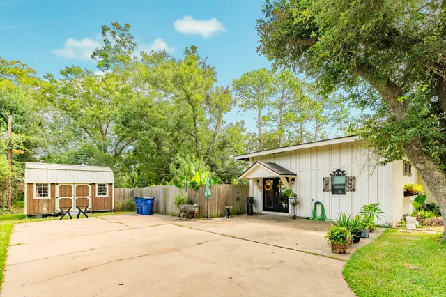 a front view of a house with a yard and a garage