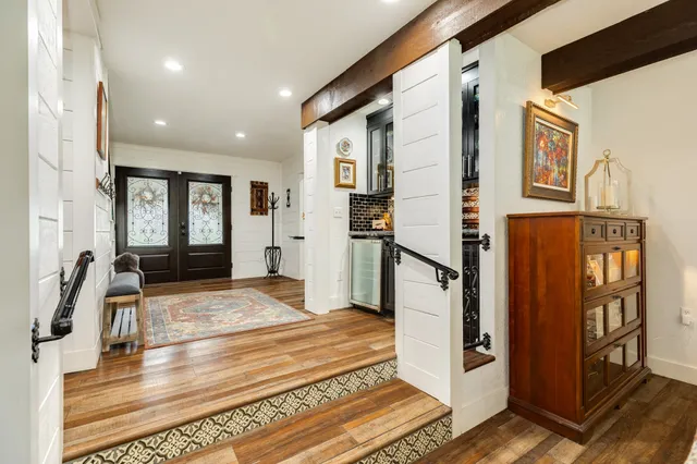 a bathroom with a sink a mirror and a shower