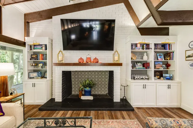 a living room with lots of furniture and a flat screen tv