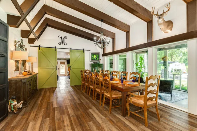 a bathroom with a glass shower door and a sink