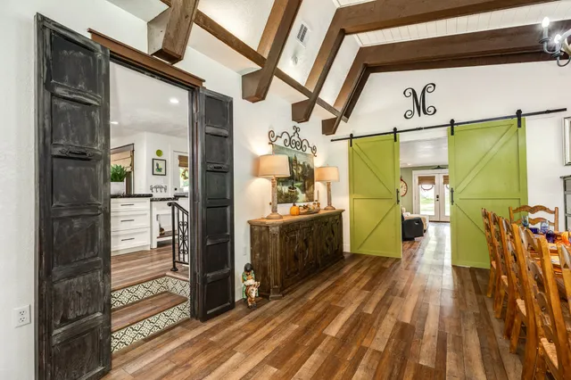 a kitchen with stainless steel appliances granite countertop a stove and a cabinets