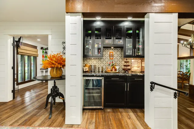 a spacious bedroom with a bed and a view of bathroom