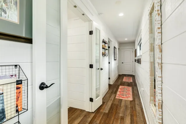 a bathroom with a sink toilet and mirror