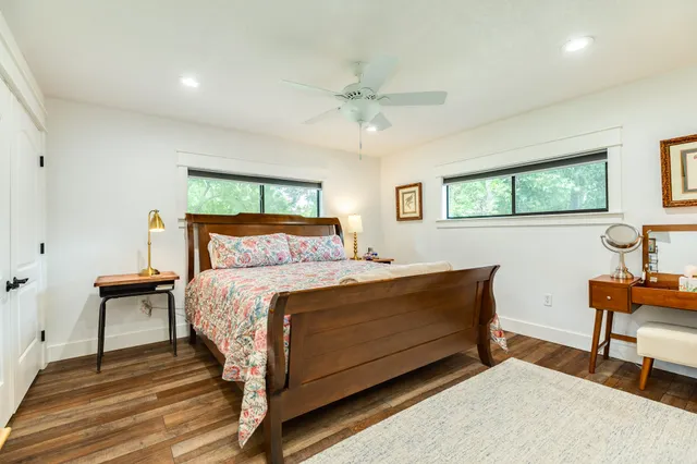 a bedroom with a bed and a dresser in it