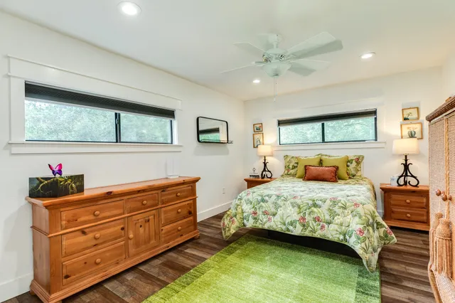 a room with a bed and window