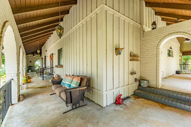 a view of an outdoor space with porch and patio