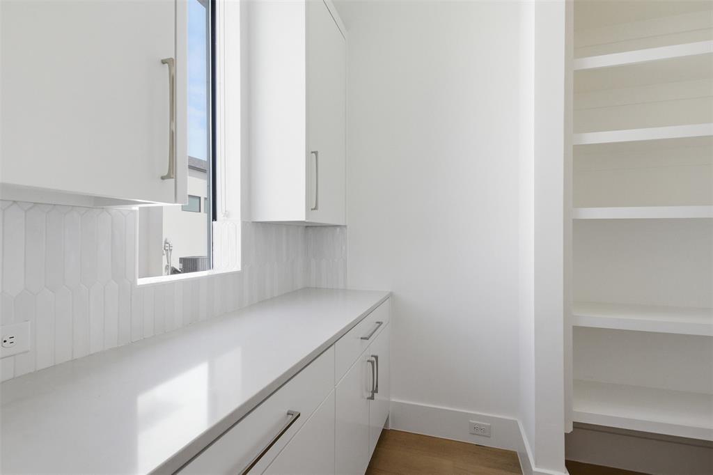 9855 Kingsway Avenue Dallas, TX 75230 - Photo 19 of 37 a view of a kitchen cabinets and a window