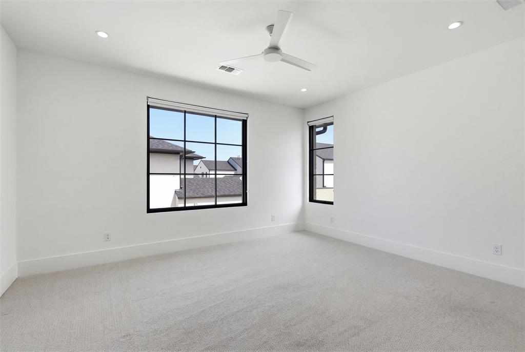 9855 Kingsway Avenue Dallas, TX 75230 - Photo 26 of 37 an empty room with windows and cabinet
