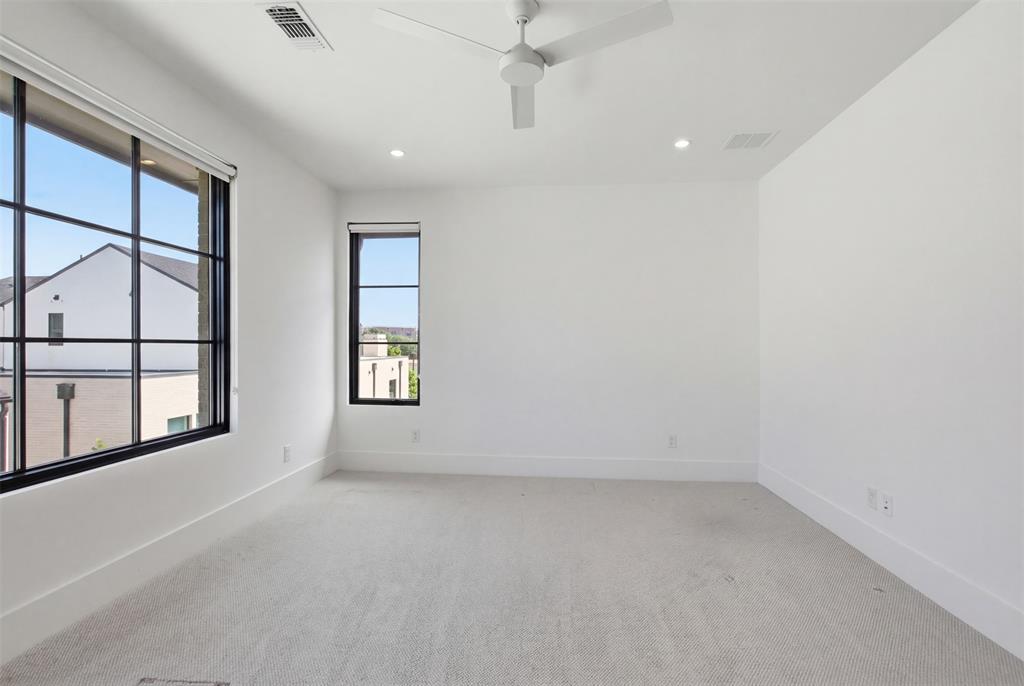 9855 Kingsway Avenue Dallas, TX 75230 - Photo 28 of 37 an empty room with windows and closet