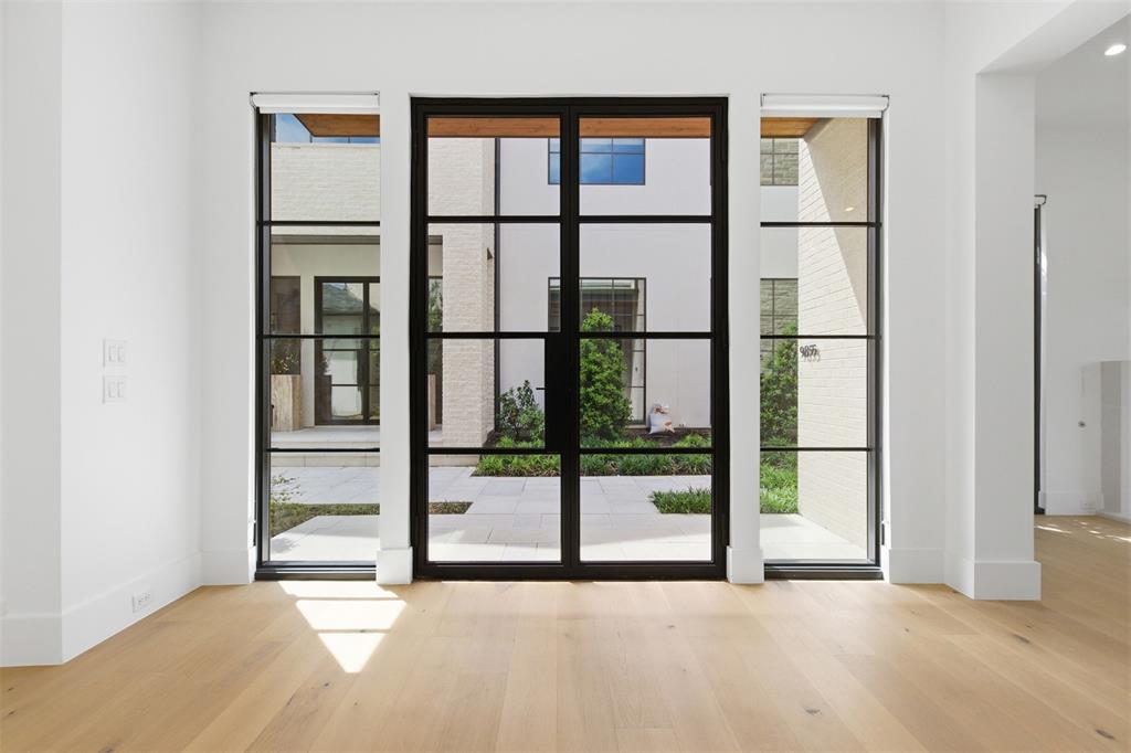 9855 Kingsway Avenue Dallas, TX 75230 - Photo 3 of 37 a view of an empty room with a window