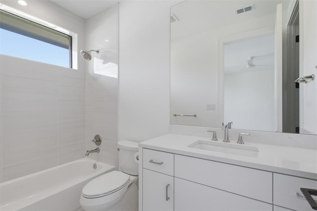 9855 Kingsway Avenue Dallas, TX 75230 - Photo 30 of 37 a bathroom with a granite countertop sink a toilet and shower