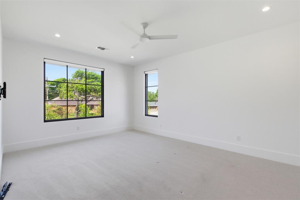 9855 Kingsway Avenue Dallas, TX 75230 - Photo 31 of 37 an empty room with windows