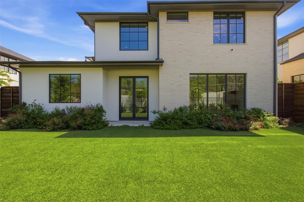 9855 Kingsway Avenue Dallas, TX 75230 - Photo 33 of 37 a front view of a house with garden