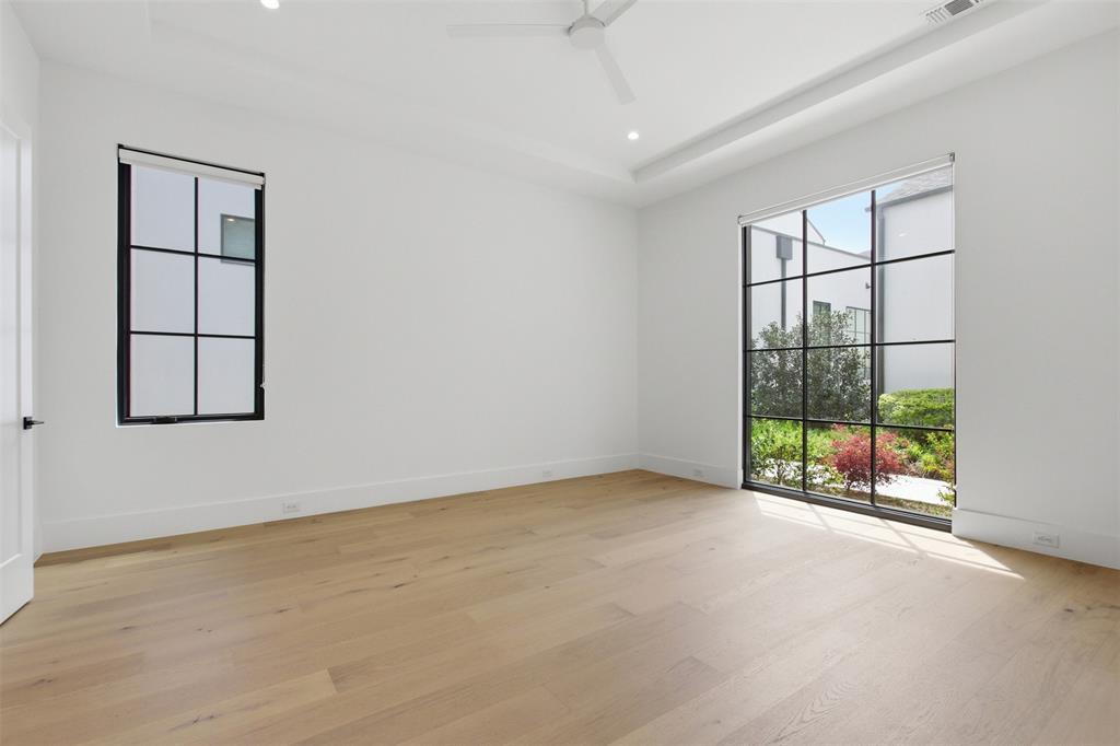 9855 Kingsway Avenue Dallas, TX 75230 - Photo 5 of 37 an empty room with windows
