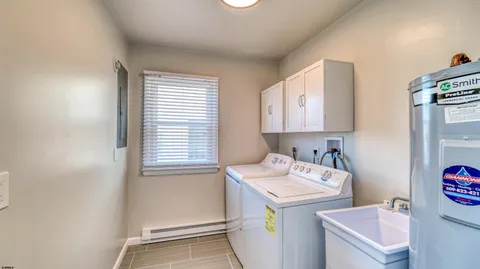 a utility room with a sink a washer and dryer
