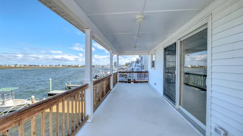 a view of a balcony with an ocean view