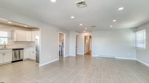 a view of an empty room with a sink
