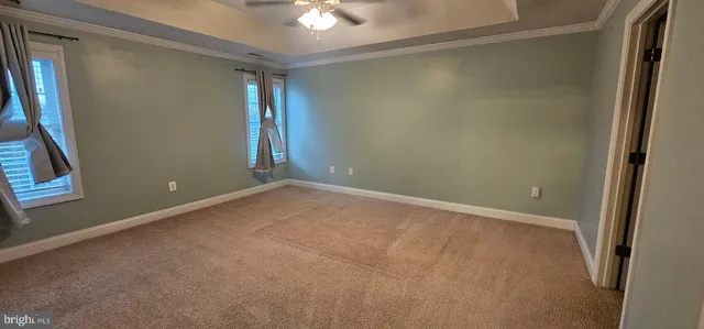 an empty room with windows and entrance