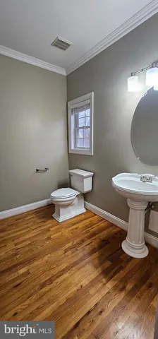 a bathroom with a toilet and a sink