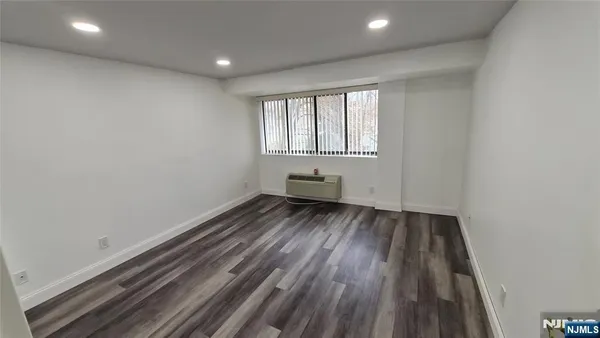 a view of wooden floor in an empty room