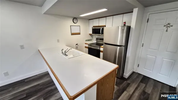 a white refrigerator freezer sitting inside of a kitchen