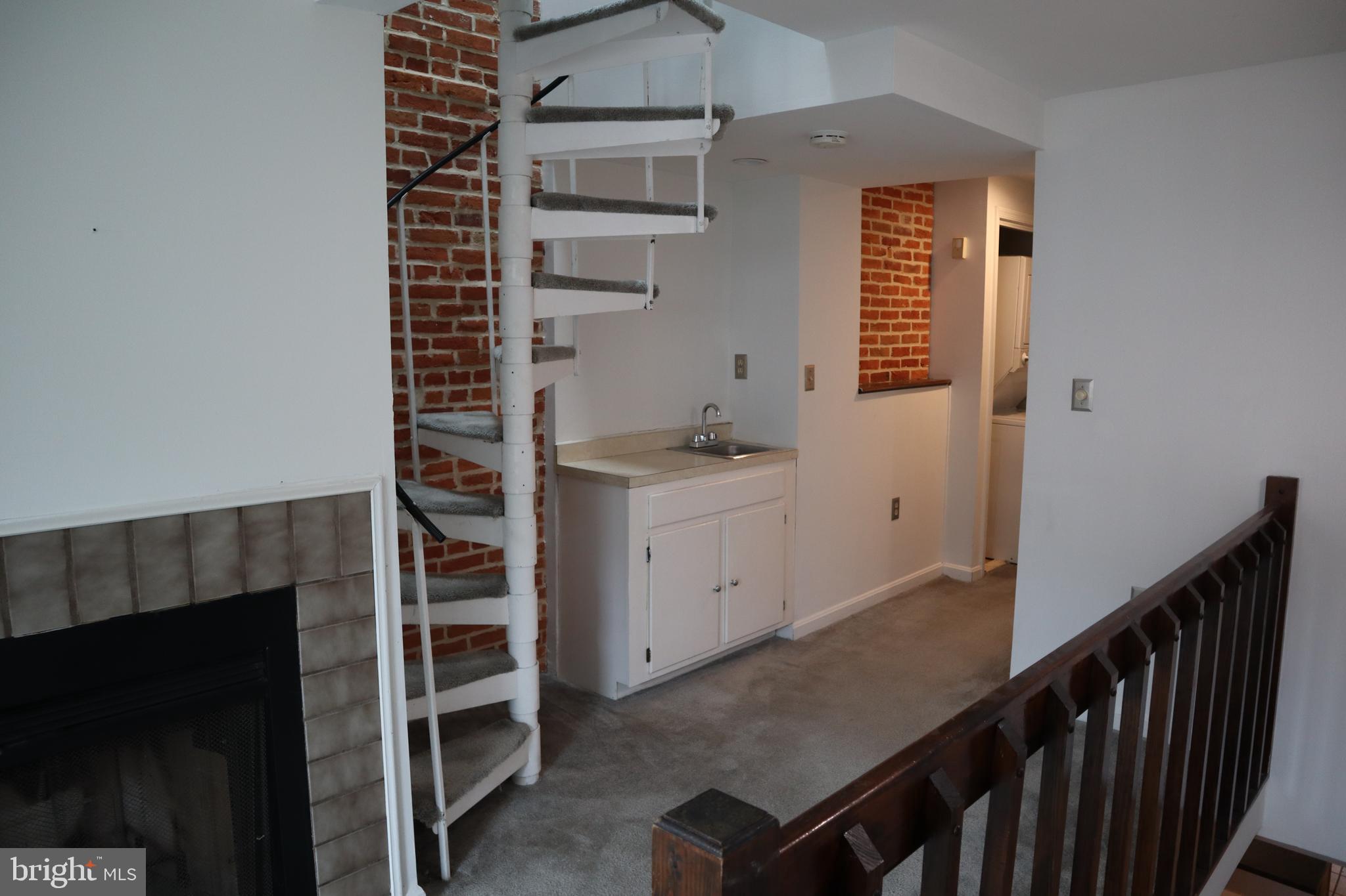 36 East Wheeling Street Baltimore, MD 21230 - Photo 14 of 20 Spiral stairs to second bedroom