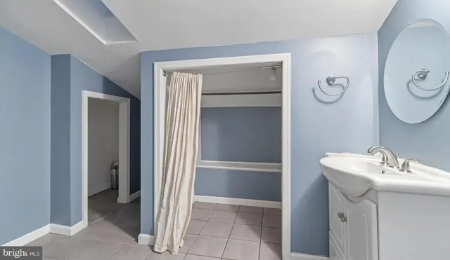 a view of an empty room with windows