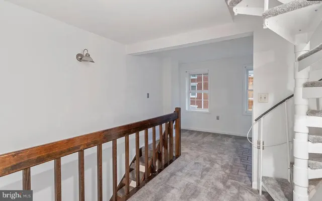 a view of a hallway with windows