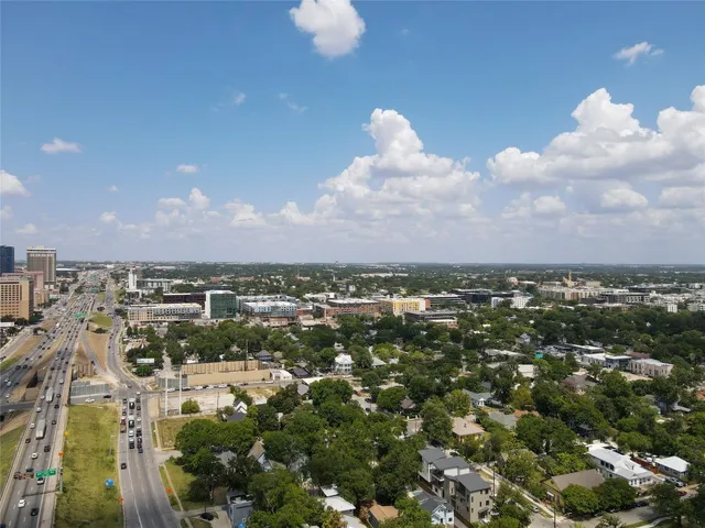 a house that has a tree in front of it
