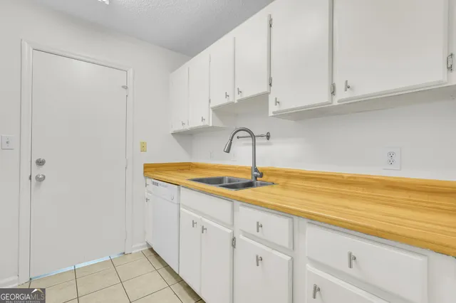 a kitchen with a sink and cabinets